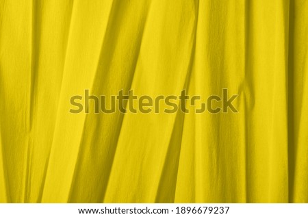 Iluminating yellow color paper background - Pantone's fashionable color of 2021.
