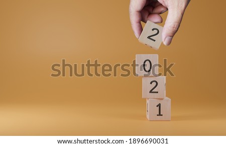 2021 on wooden cubes. New year concept