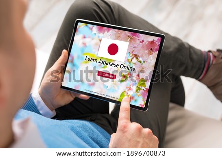 Man taking online courses and learning Japanese language