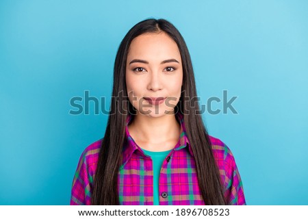 Photo of gorgeous person tender smile look camera wear purple checkered clothing isolated on blue color background