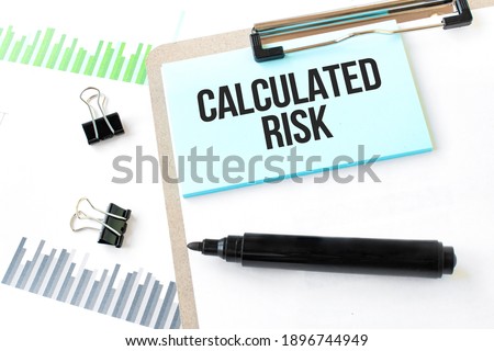 Paper plate,marker, diagram,chart and office tools. Text Calculated risk
