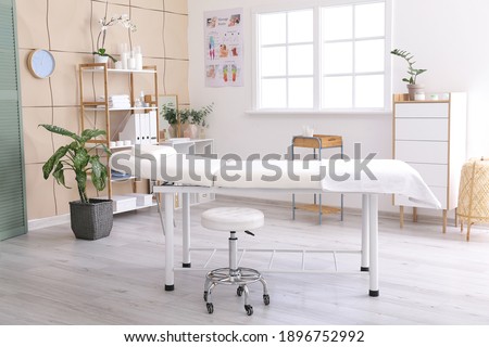 Office of massage therapist in modern medical center Royalty-Free Stock Photo #1896752992