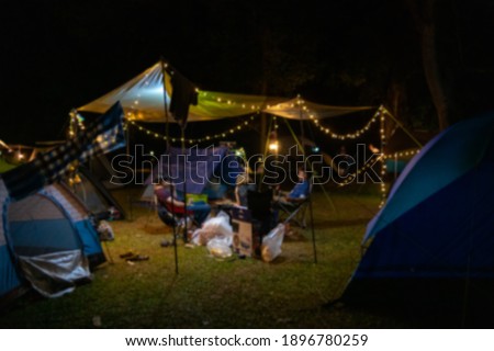A group of people camping And I'm eating. Blurred focus. The picture contains nuts and grain films.