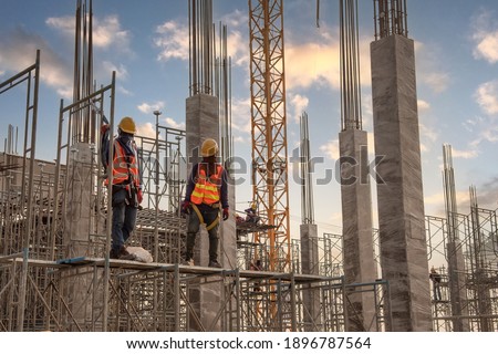 Construction worker at construction site Royalty-Free Stock Photo #1896787564