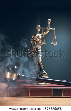 lady justice with judge gavel in front on dark background
