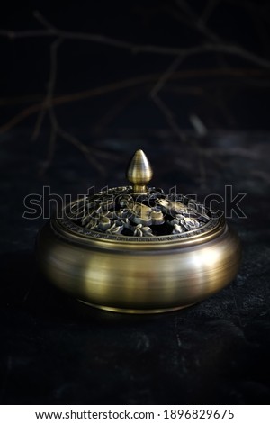 incense
burning holder on the table,still life photography