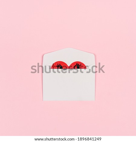 A heart peeps out of a white envelope. Cheerful picture for valentine's day. A funny love letter, a humble confession of feelings. Beautiful background with white envelope and place for text