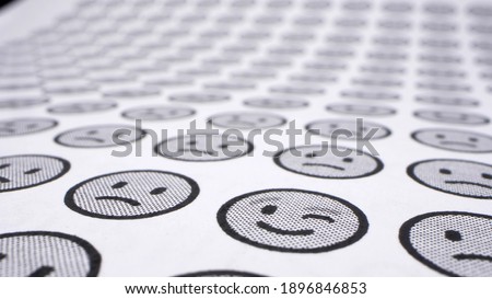 extremely close-up, detailed. smilies background. one cheerful smile among many sad ones.