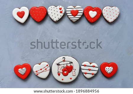 Valentine's day Homemade cookies on Ultimate Gray background, top view. Space for text. Delicious and sweet, covered with icing with a beautiful pattern gingerbread