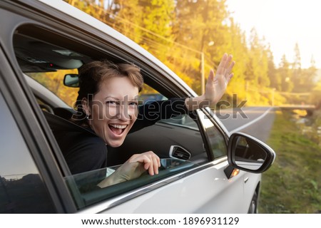 Portrait of young adult beautiful caucasian woman driver enjoy roadtrip adventure traveling by car on mountain nature forest landscape. Happy female person family journey trip lifestyle