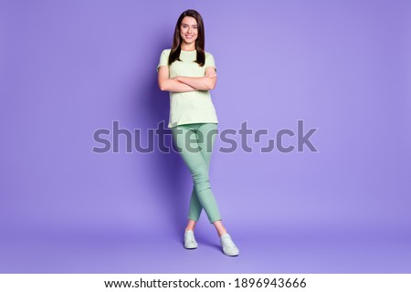 Photo portrait full body view of confident girl with crossed arms legs isolated on vivid purple colored background