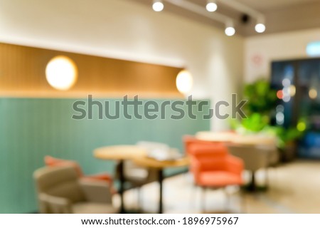 Abstract blur modern restaurant and coffee shop cafe interior for background.