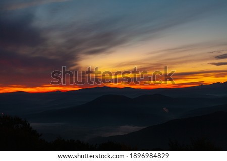 Scenic view of Mountains against sky during sunrise. Majestic sunrise over the mountains
