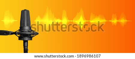 Professional studio microphone on orange and yellow background with signal waveform and copy space, broadcasting, recording studio or podcast banner