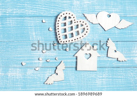 Decor elements for Valentine's Day on a wooden surface, top view.