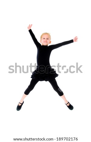 A pretty preschooler jumping ballerina outfit. Isolated on white.
