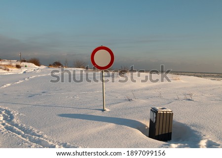 It is forbidden to enter a sign on a snowy road
