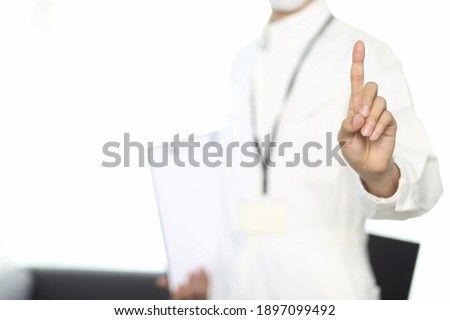 Cropped image of engineer pointing finger 