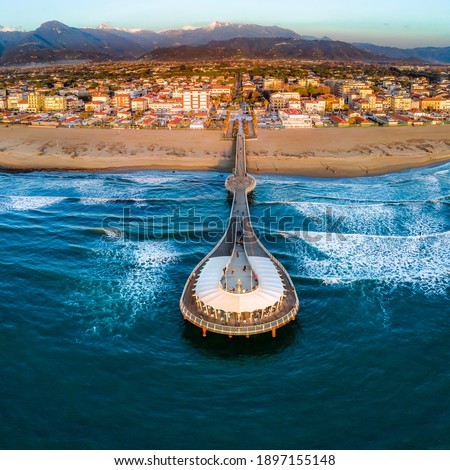 Versilia's pier from the sea - aerial view of "lido di Camaiore" - the beach Royalty-Free Stock Photo #1897155148