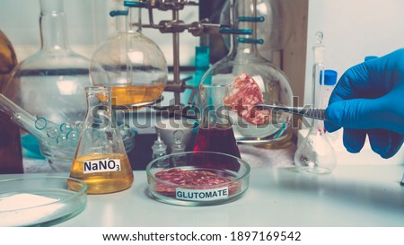 Photo Food additives in sausages. Flavor enhancers and nitrates. Unhealthy food concept. Royalty-Free Stock Photo #1897169542
