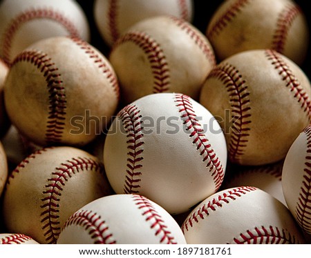 a photograph of many baseballs
