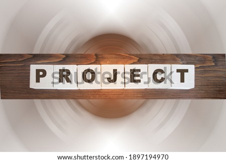 Project word letters on wooden blocks on wooden table. Project marketing business startup Risk management concept.