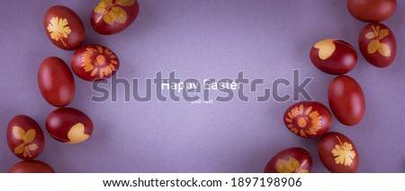 Red Easter eggs on a gray background. Easter background with eggs close-up. Place for text. Grey
background