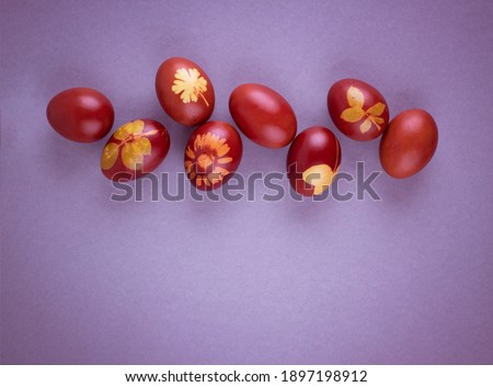 Red Easter eggs on a gray background. Easter background with eggs close-up. Place for text. Grey
background