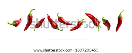 Red fresh chili pepper isolated on white background. Seasoning for dish, hot pepper, spicy spices for cooking, cayenne pepper, food. Set of peppers of different shapes for your design Royalty-Free Stock Photo #1897205455