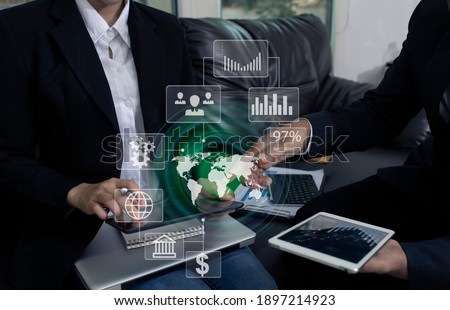 Double exposure of businesswoman working on digital tablet with digital marketing virtual chart, Abstract icon, Business finance technology concept. blurred background.