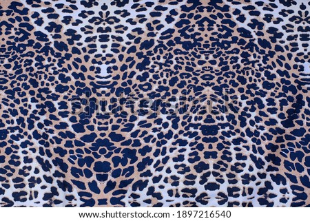 Fabric with a print of leopard, cheetah skin, close-up, place for text