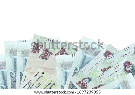 500 UAE dirhams bills lies on bottom side of screen isolated on white background with copy space. Background banner template for business concepts with money Royalty-Free Stock Photo #1897239055