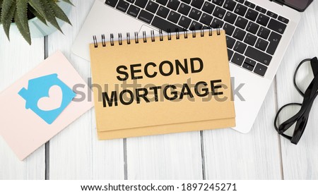 Paper with Second Mortgage on a table
