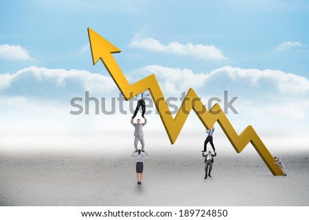 Business team holding up arrow against cloudy landscape background