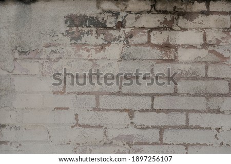 brick wall with cracked stones, empty wall for a banner or background, space for text  no person