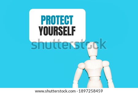 The wooden man and white cloud with text PROTECT YOURSELF. The content of the lettering has implications for business concept and marketing.