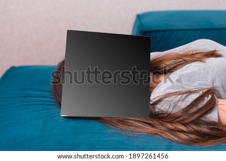Photo of woman sleeping with book on her head