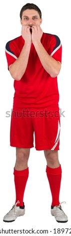 Nervous football player looking ahead on white background