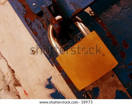 Padlock on a rusty background with old paper peeling off.