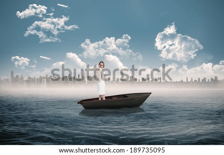 Composite image of severe pretty businesswoman in a sailboat in the sea with city on horizon