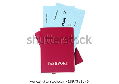 Two red passports, blue flight boarding pass, ticket white background isolated close up top view, airplane travel, passenger check in control, holidays, vacation, international tourism, design element