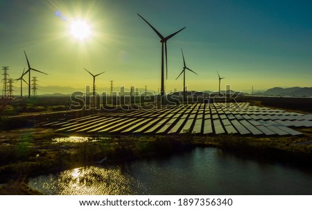 Wind turbine tower construction with beautiful landscape and blue sky to generate clean renewable green energy for sustainable development to prevent climate change and global warming to protect earth Royalty-Free Stock Photo #1897356340