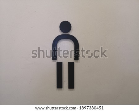 The male symbol on the wall is used for white backdrop illustrations