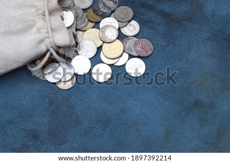 Money and money bag on old cloth