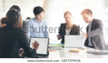 Group of business people working together in office room.