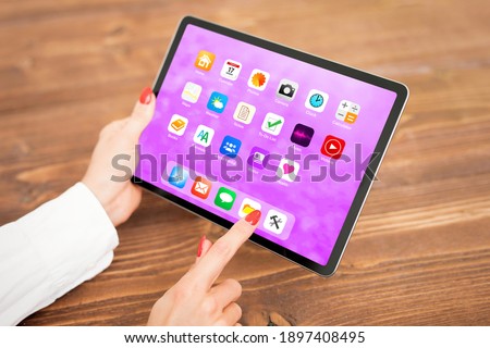 Woman using tablet computer, screen mockup.