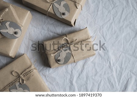 gift boxes on a linen background. Zero waste holiday and environmental concept. Top view flat lay copy space. High quality photo