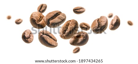 Coffee beans levitate on a white background Royalty-Free Stock Photo #1897434265