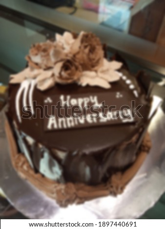 blurred homemade birthday cake with happy anniversary