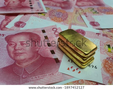 Gold bars on china banknotes